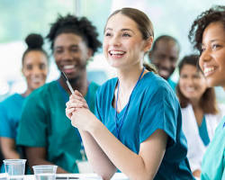 Hình ảnh về group of nursing students in uniform smiling and learning in a classroom