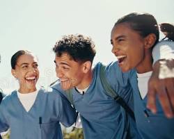 Hình ảnh về Students in nursing uniforms smiling and studying together