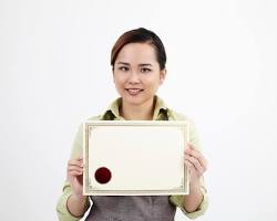 Hình ảnh về Person holding a computer certificate with a smile