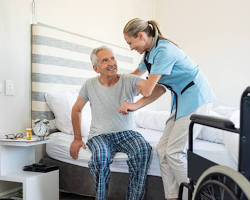 Hình ảnh về Nurse assisting a patient smiling