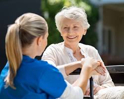 Hình ảnh về Nurse smiling and caring for a patient