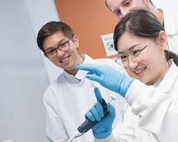 Hình ảnh về Pharmacy students in a lab coats during practical session